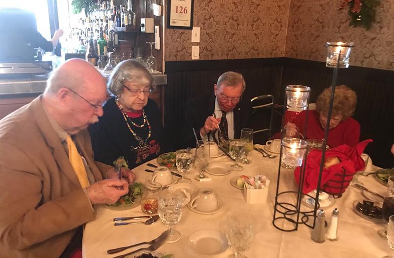 Russell and Dawson team members at dinner meeting